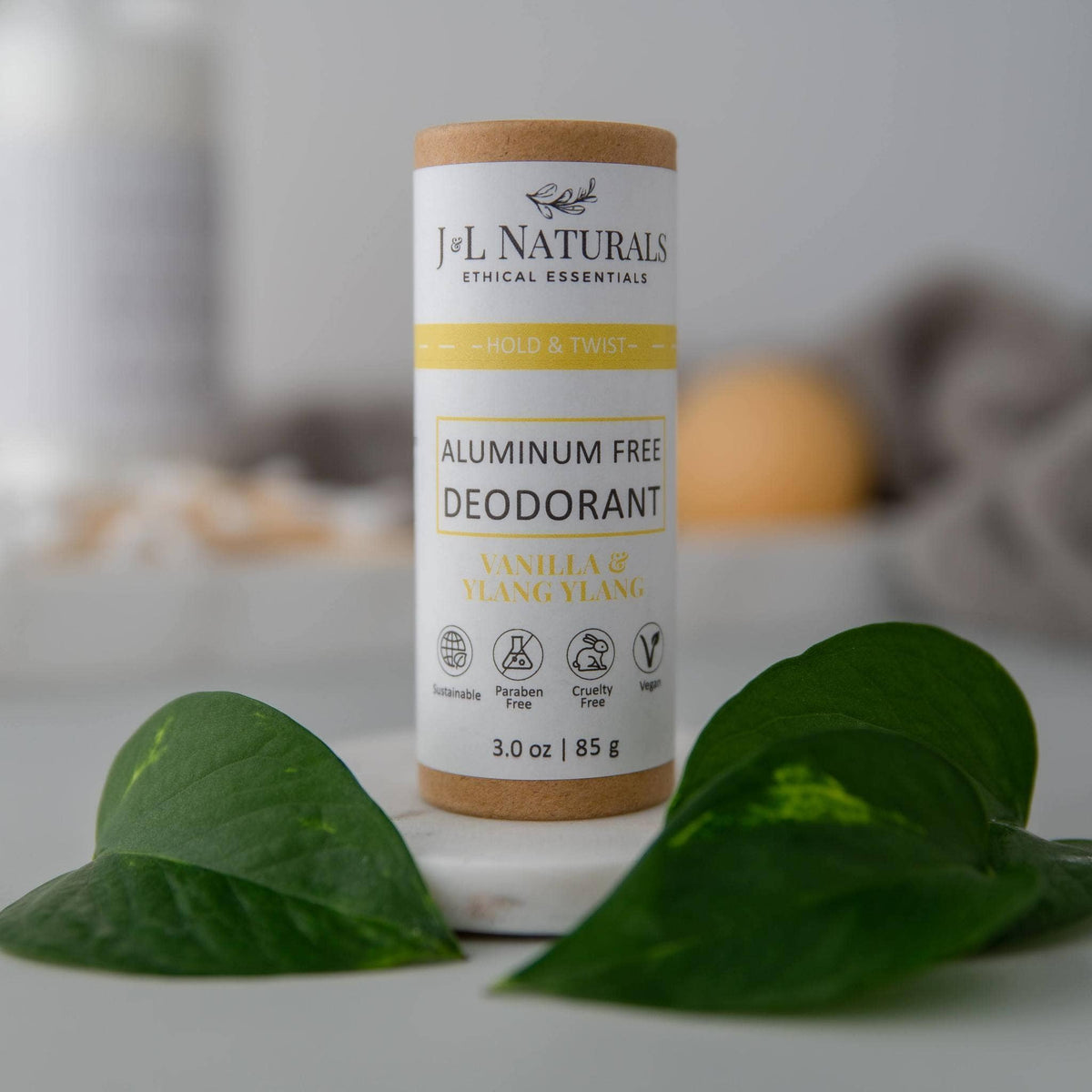 J&L Naturals Extra-Strength Deodorant (Full Size - deodorant beside green botanicals; vegan