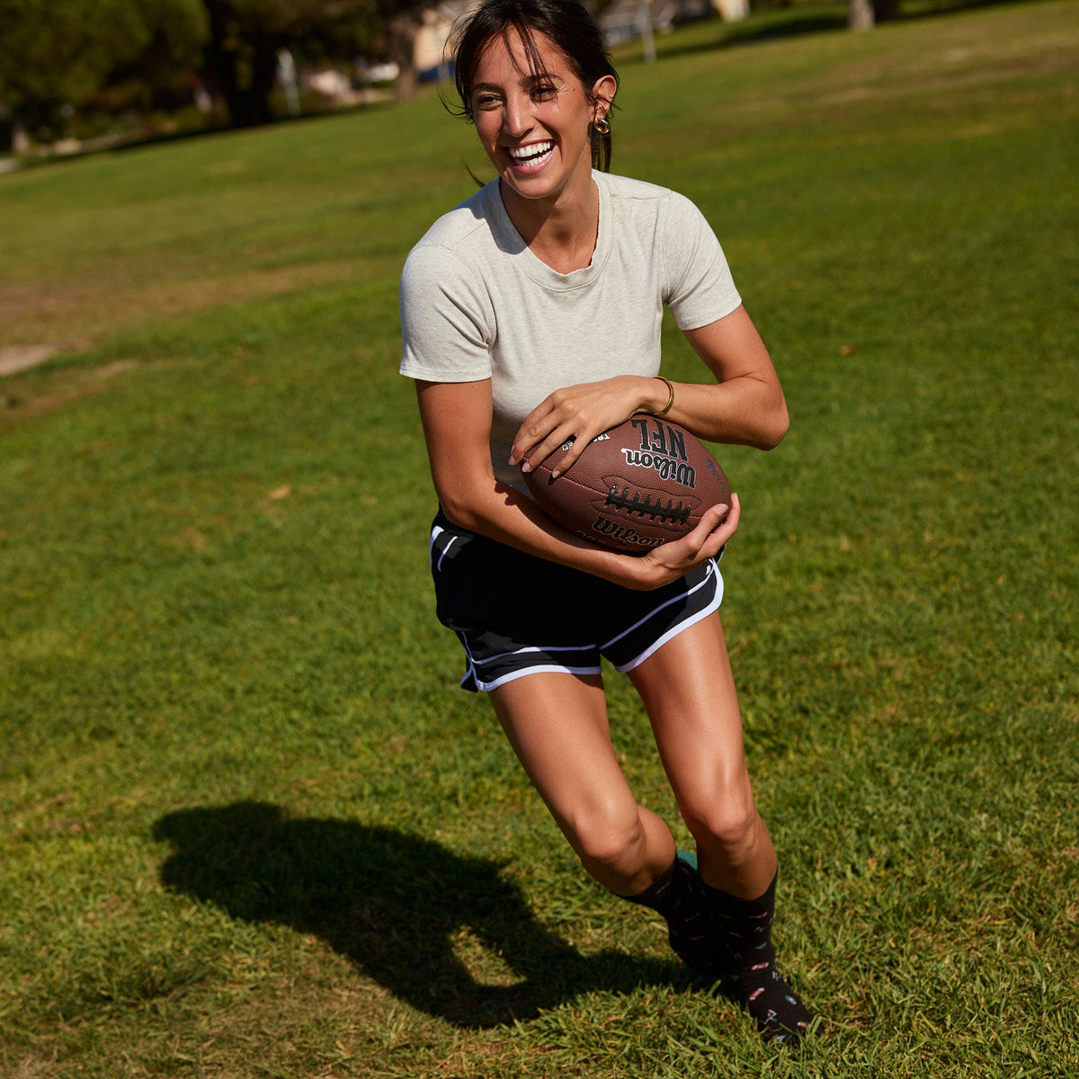 Socks that Support Youth Sports | Black Footballs