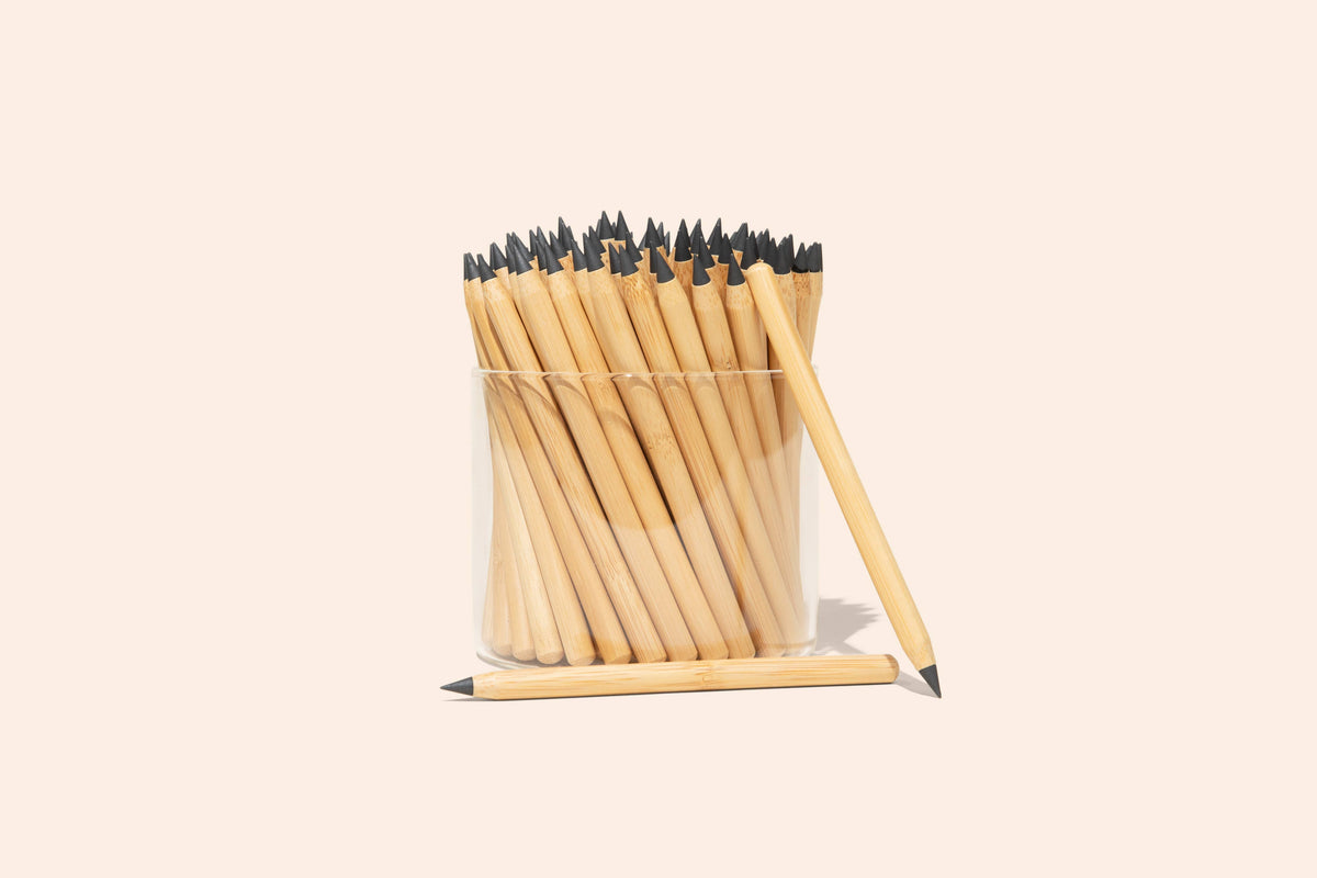 Bamboo Switch reusable bamboo pencils with alloy tips in a glass jar with one pencil beside it