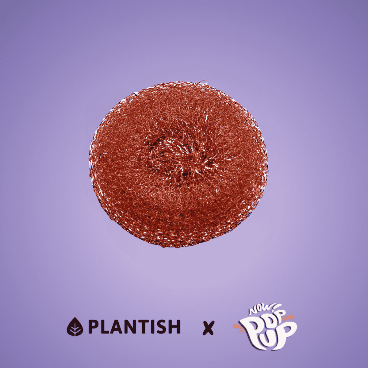 Plantish recycled-copper pop-up dish scrubby, round copper-colored Plantish recycled copper scrubby on purple background