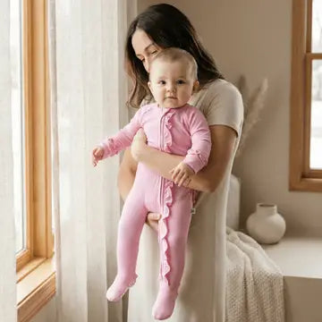 Sweet Bamboo Pink Ruffle Footie Onsie: baby garment laid out to show pattern