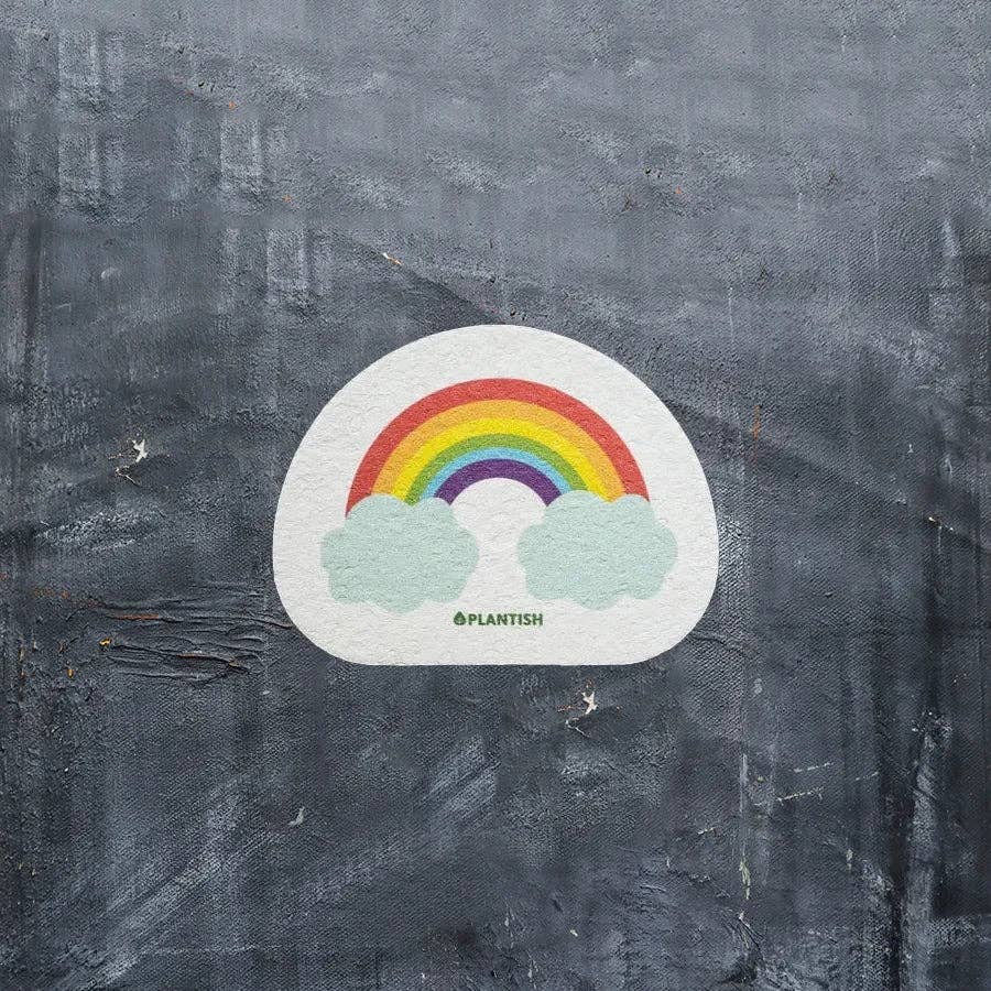 Plantish Rainbow Cloud - Pop-up Sponge - rainbow cloud sponge against dark surface; plant-based