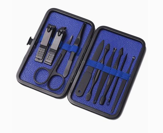 Mad Men travel grooming kit opened to show nail clippers, scissors and men's grooming tools