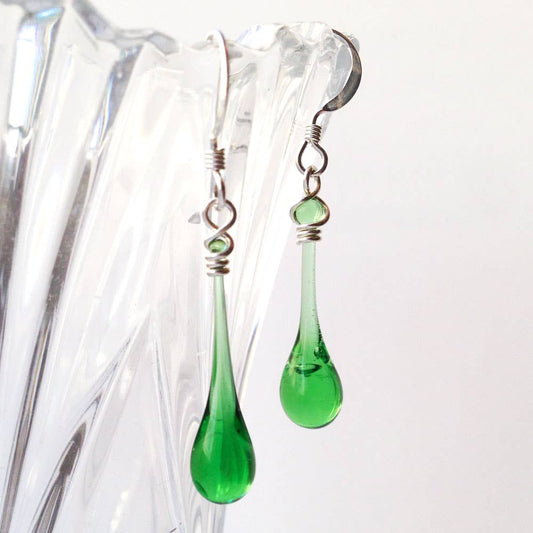Sundrop Jewelry upcycled recycled-glass Solaris earrings — green teardrop glass dangle earrings in sunlight