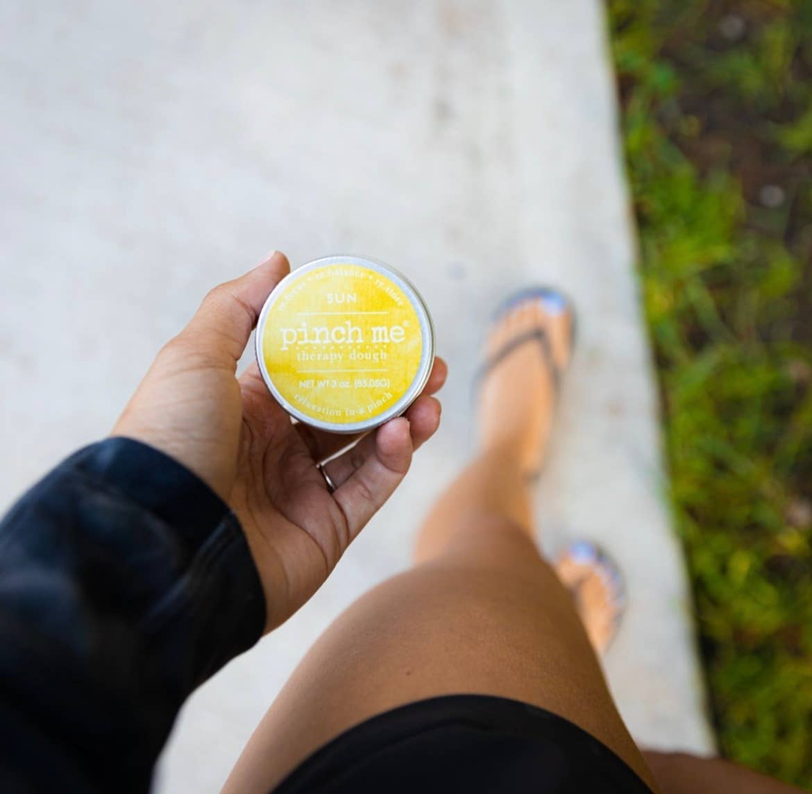 Pinch Me Therapy Dough – Sun, handheld close-up showing the product