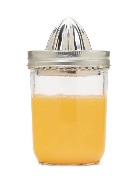 Fox Run Brands stainless mason jar juicer lid, stainless Jarware citrus juicer lid attached to jar of orange juice