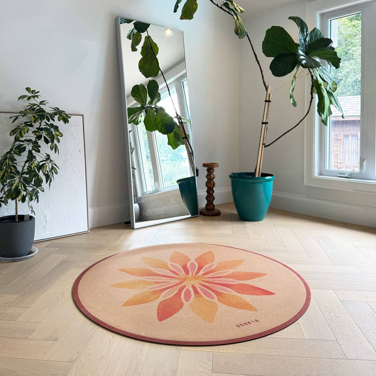 Scoria ® – Solar Bloom Round Cork Yoga Mat | Multi-use | 53" dia, photographed on a model or user; natural cork material
