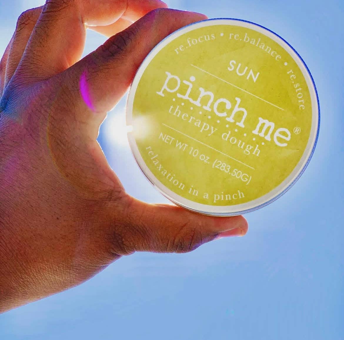 Pinch Me Therapy Dough – Sun, product held in a hand