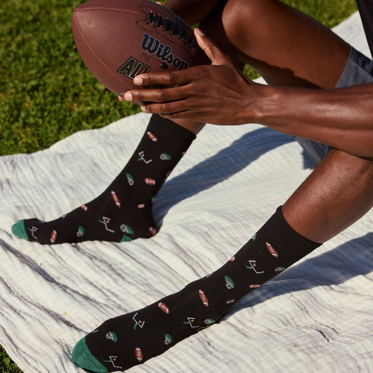 Socks that Support Youth Sports | Black Footballs