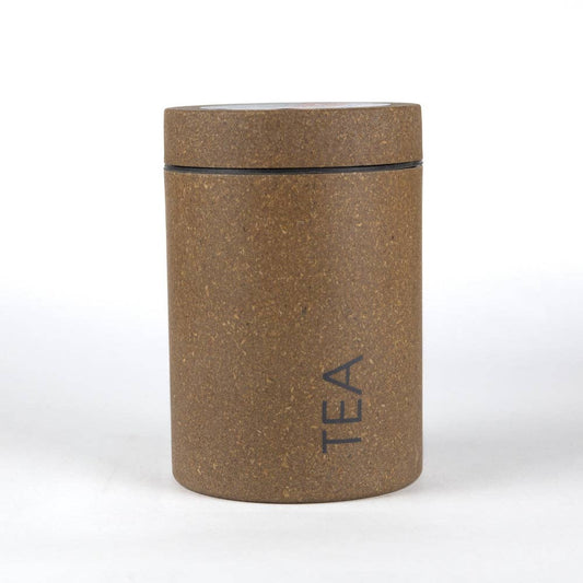 Loopy Products upcycled agricultural-waste bamboo tea canister, small sand brown tea storage tin closed on white