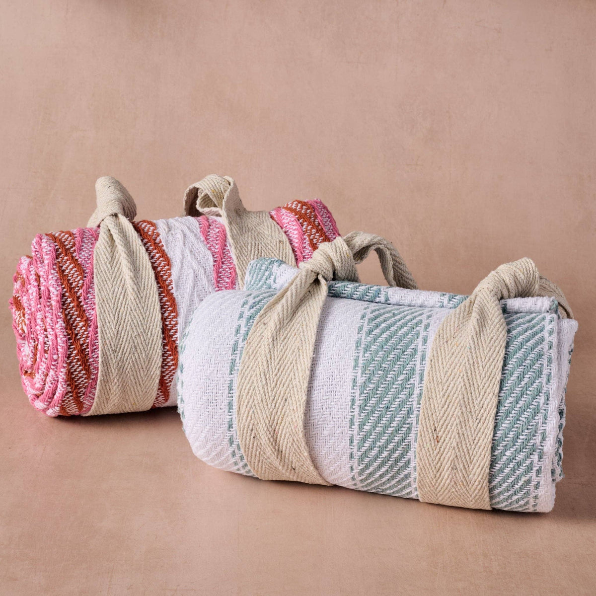 Ten Thousand Villages Garmee Upcycled Cotton Beach Blanket - Pink: side angle showing shape and; recycled cotton fabric