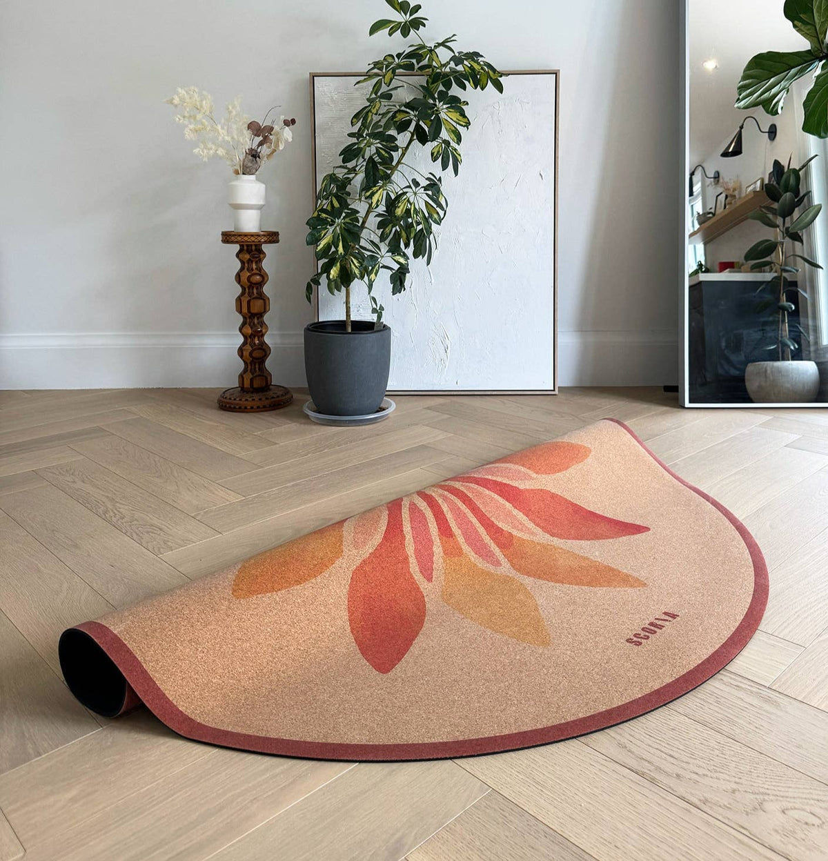 Scoria ® – Solar Bloom Round Cork Yoga Mat | Multi-use | 53" dia, styled in a lifestyle setting; natural cork material