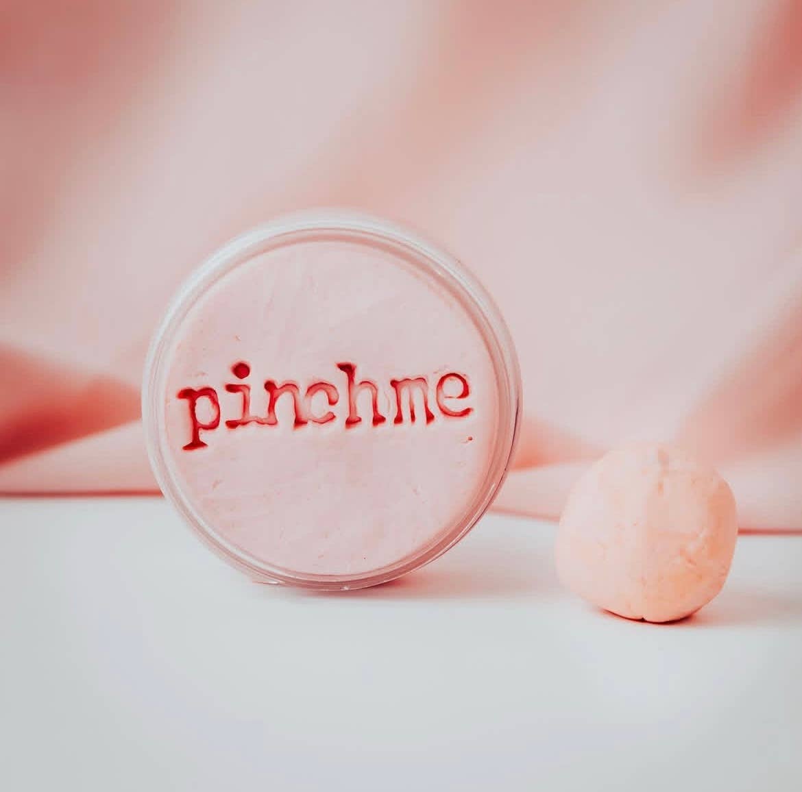 Pinch Me Therapy Dough – Relief, in a decorative flat-lay setting