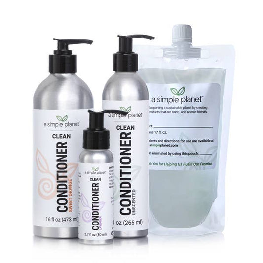 A Simple Planet refillable Clean Conditioner pump bottles and hair-care refill pouch on white backdrop