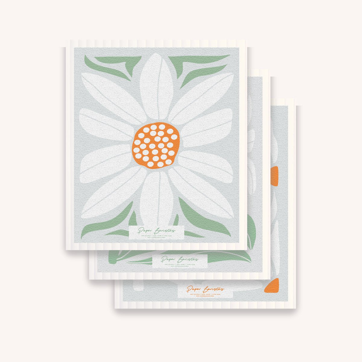 Paper Baristas compostable Swedish dishcloth set with daisies, three daisy pattern cellulose dishcloths stacked