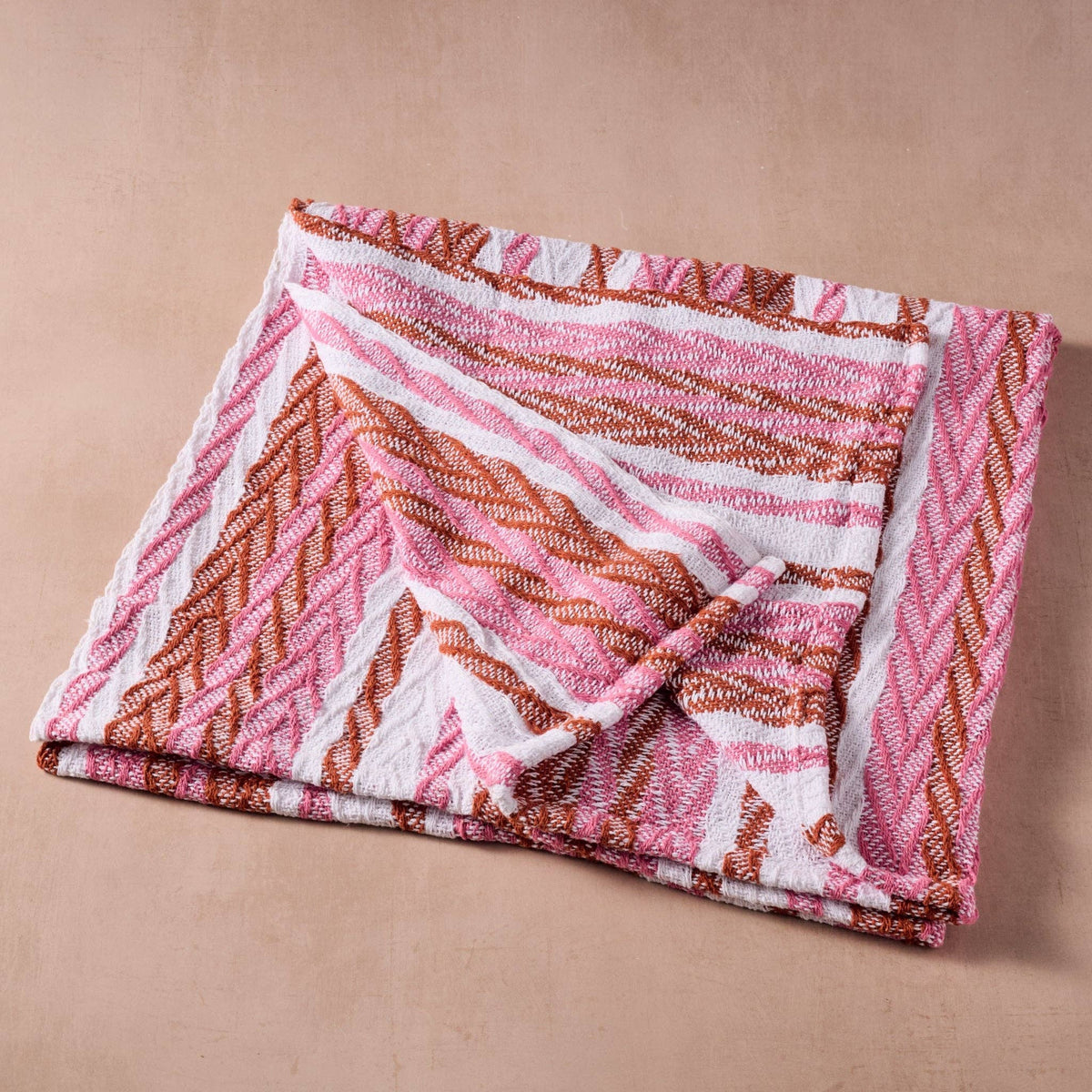 Ten Thousand Villages Garmee Upcycled Cotton Beach Blanket - Pink: close view of design and finish