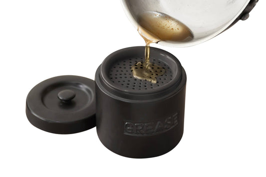 Fox Run Brands – Grease Container, Black Porcelain, 5" x 5" x 5.5", product held in a hand