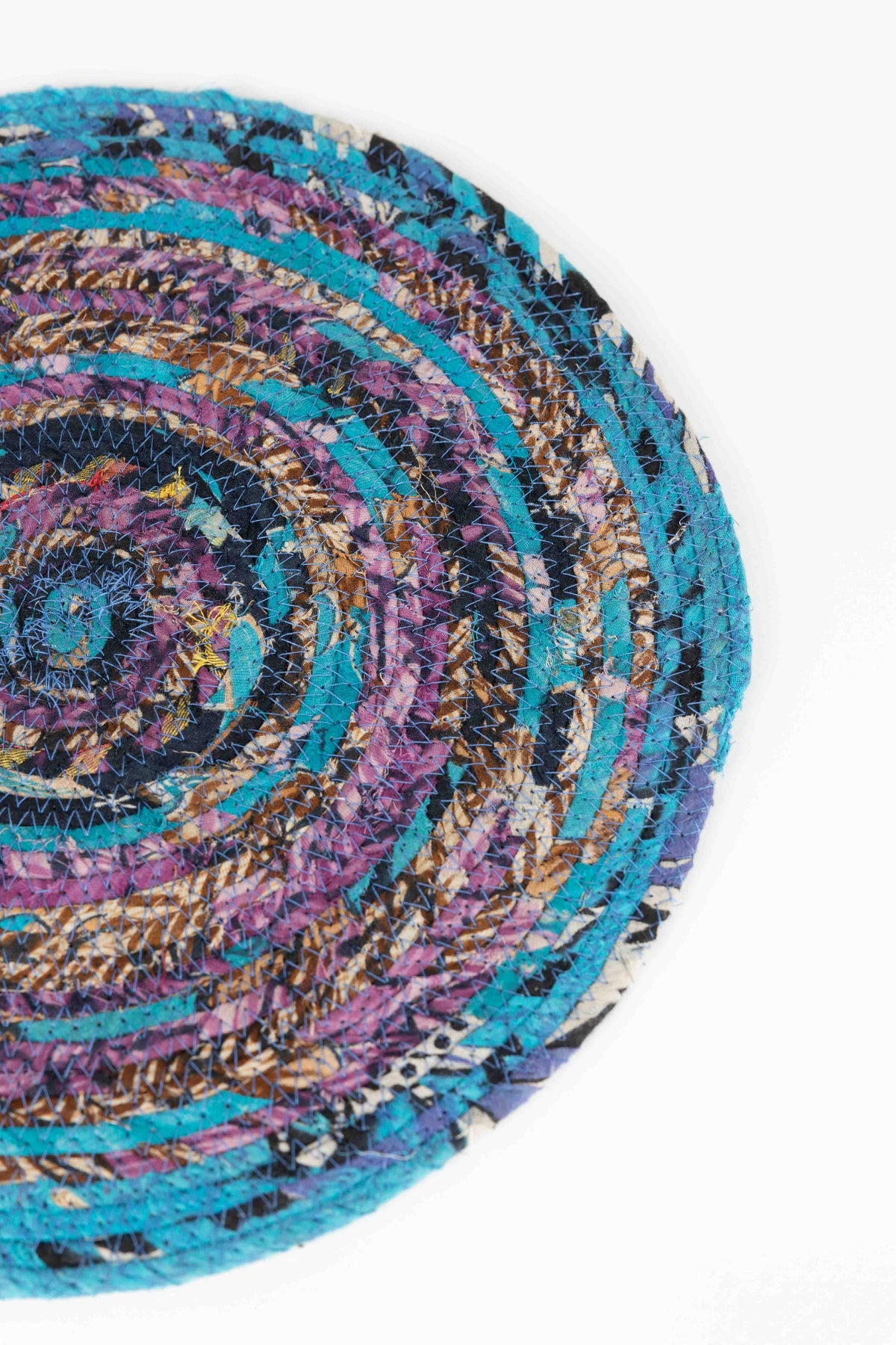 Ten Thousand Villages Recycled Sari Round Placemat: close view of design and finish