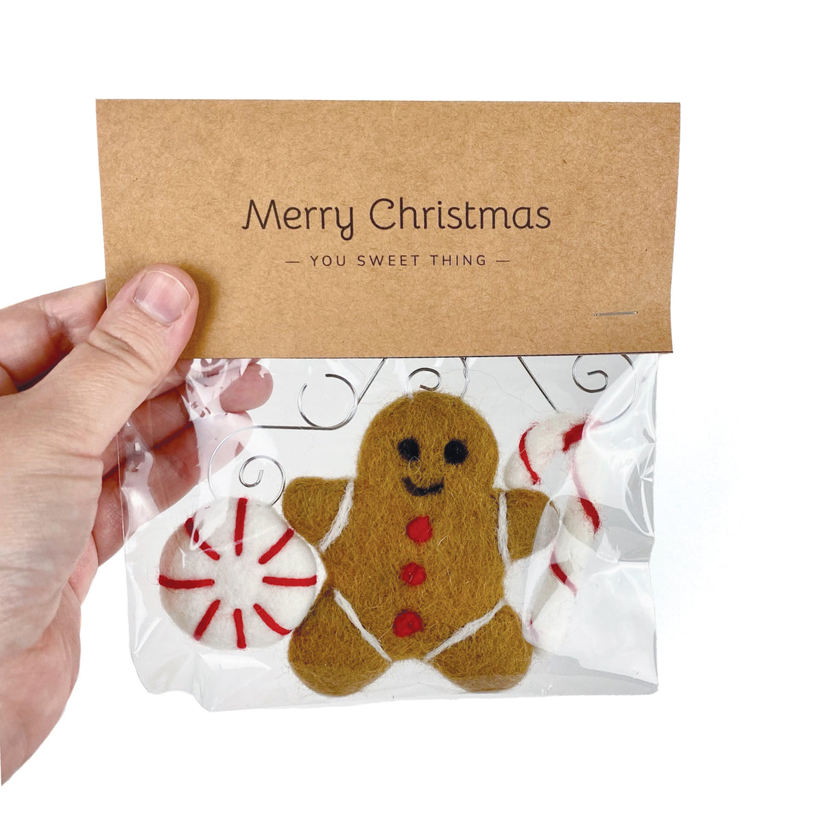 Sheep Farm Felt fair-trade felt Christmas ornament, clear retail bag containing felt gingerbread and peppermint ornaments