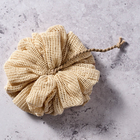 Ten Thousand Villages organic cotton loofah body scrubber in natural tan mesh with hanging loop