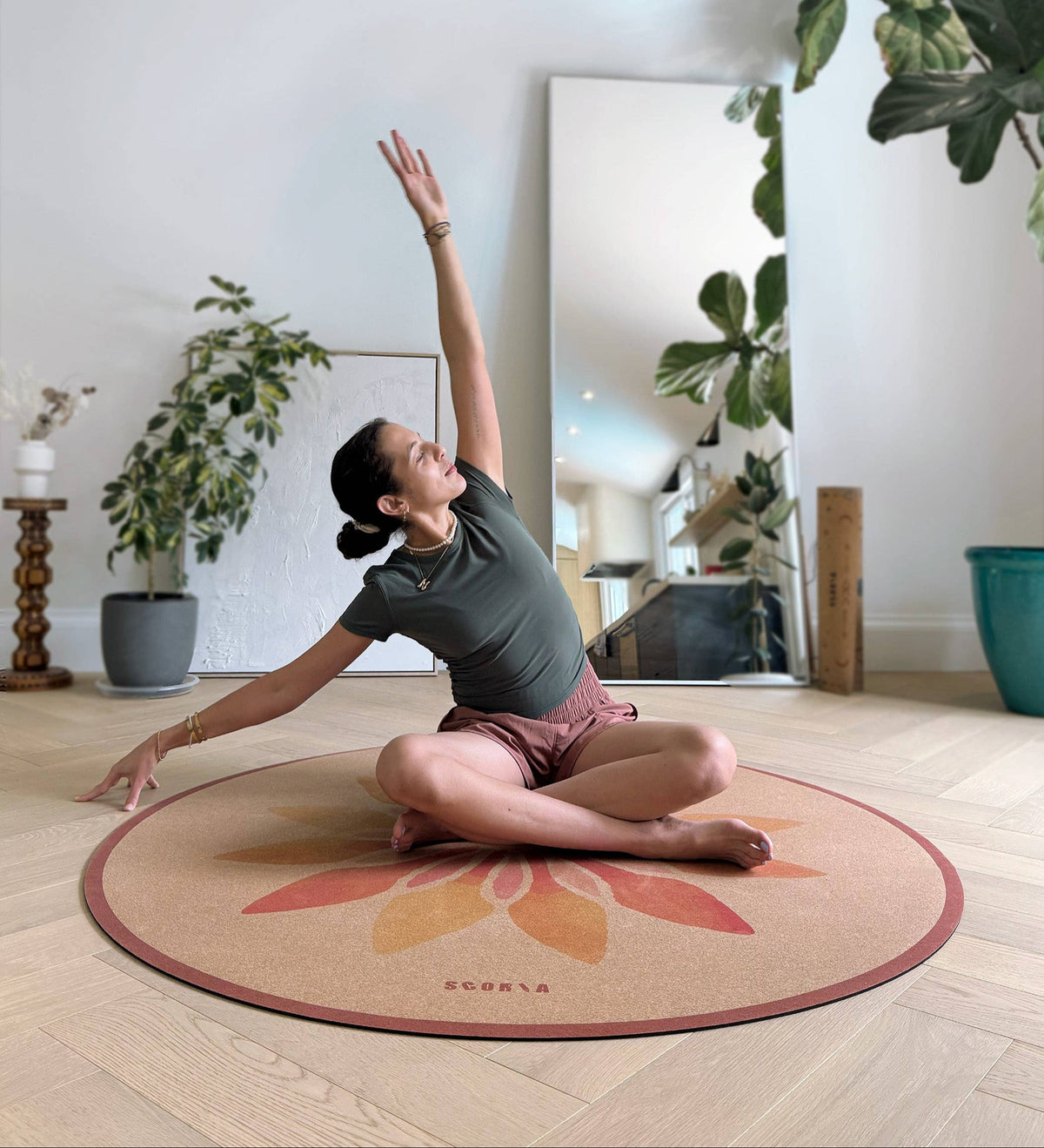 Scoria ® – Solar Bloom Round Cork Yoga Mat | Multi-use | 53" dia, shown in a yoga practice space; natural cork material