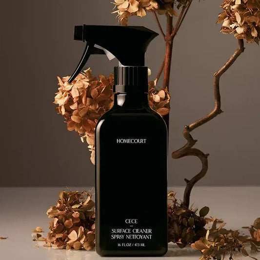 Homecourt plant-based luxury surface cleaner — black surface cleaner spray with amber flower stems
